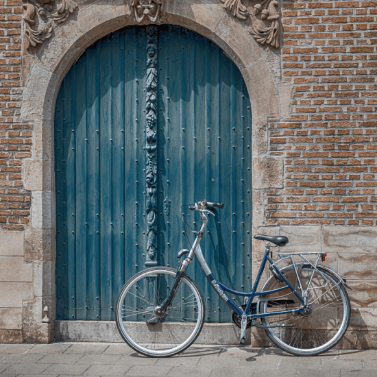 a green door with a bicycle