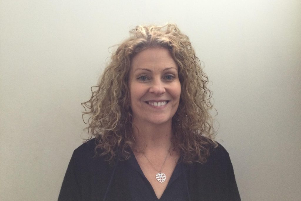 Brenda Walker smiling, with curly fair hair
