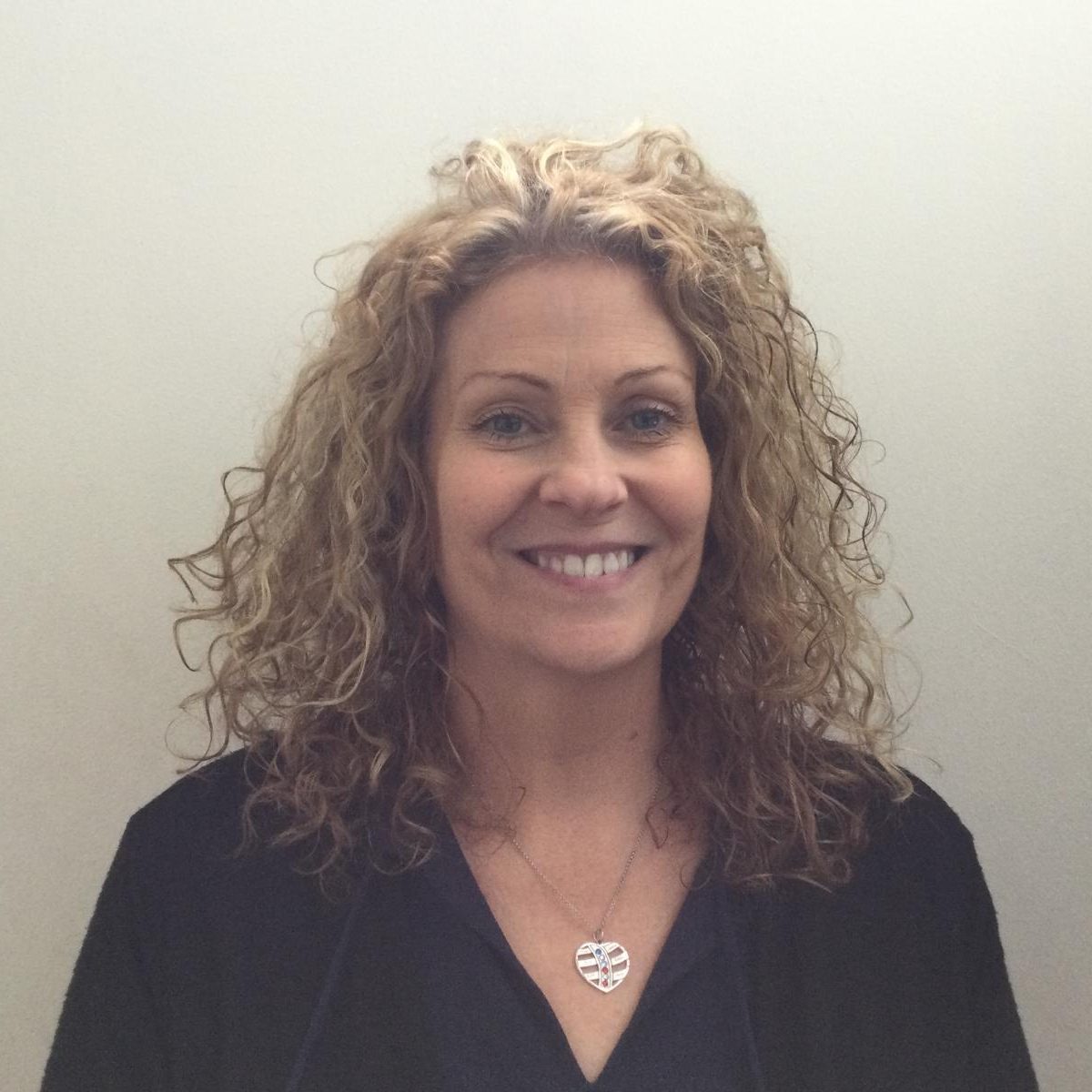 Brenda Walker smiling, with curly fair hair